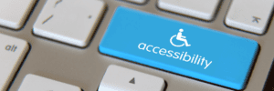 Close-up of keyboard with a blue key labeled "Accessibility"