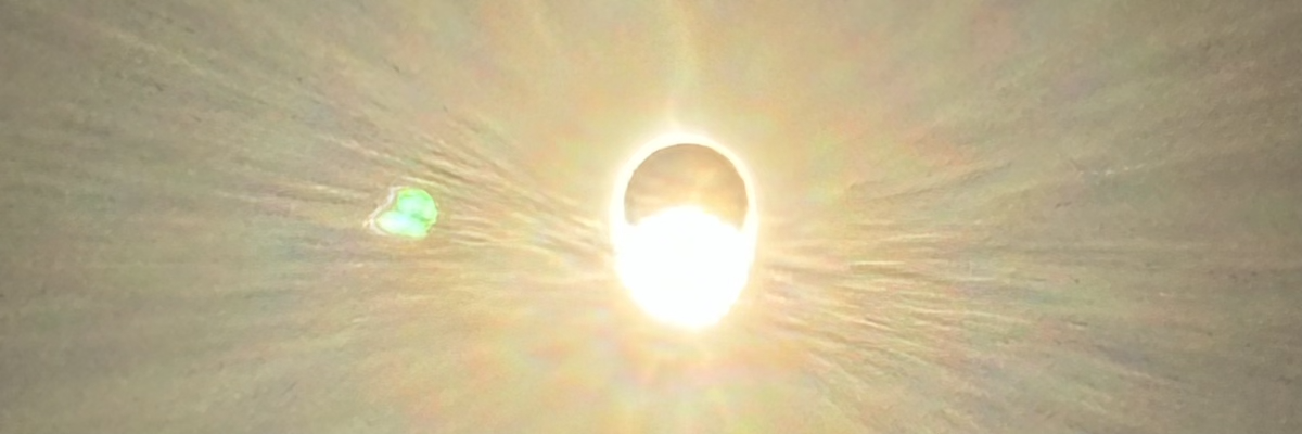 The sun peeks out from behind the moon at the end of the April 8, 2024 total solar eclipse