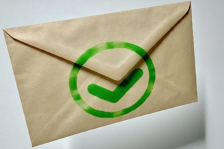 A beige envelope with bright green checkmark stamped on it floats away
