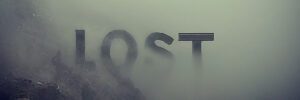 The word 'lost' in dark lettering fading away into an eerie greenish fog