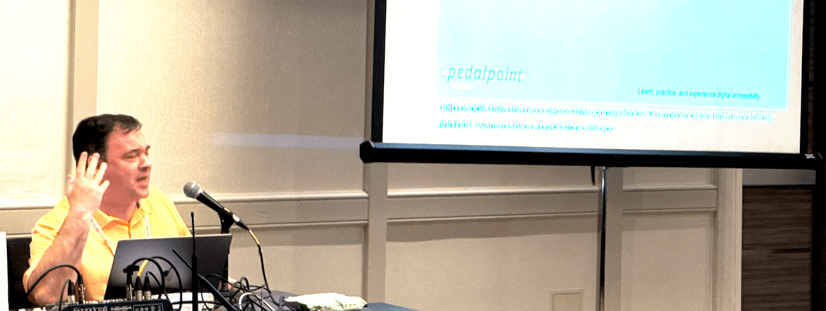Simon Miner speaks at CSUN 2025 about building empathy to drive accessibility initiatives. Photo by Chelsea Nguyen.
