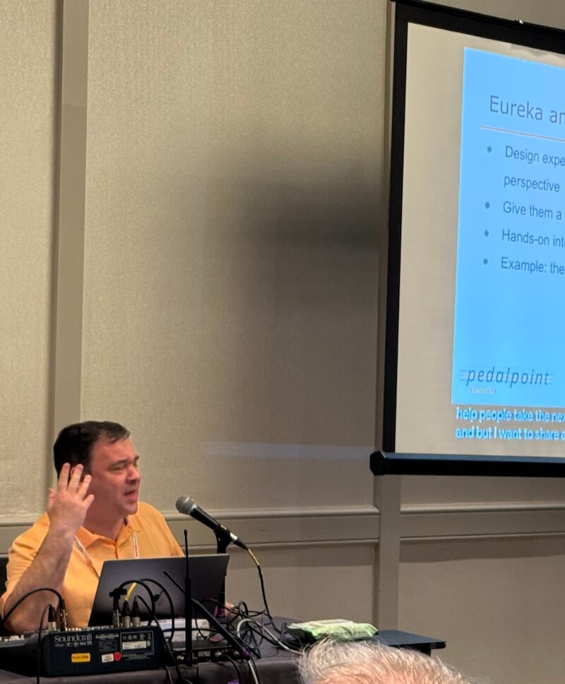 Simon Miner speaks at CSUN 2025 about building empathy to drive accessibility initiatives. Photo by Chelsea Nguyen.